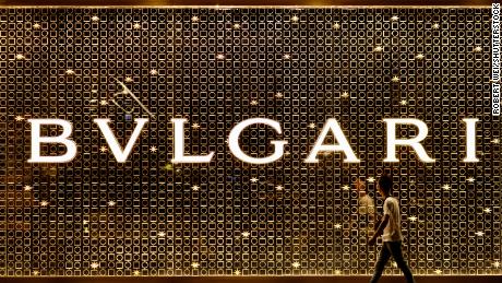A man walks past a Bvlgari&#39;s store in Shanghai, China in July 2019.