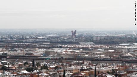 Snow covers rooftops on either side of the U.S.-Mexico border as seen on Wednesday, from El Paso, Texas. 