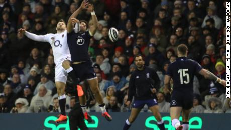 Sean Maitland of Scotland and Elliot Daly of England contest a high ball.
