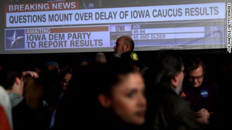 Voters watch CNN coverage on election night.