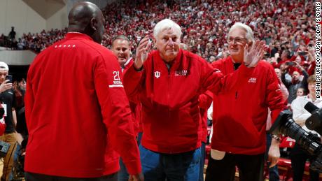 Indiana University  former coach Bob Knight, center, waves to Hoosier fans as he returns to the university for the first time in 20 years.