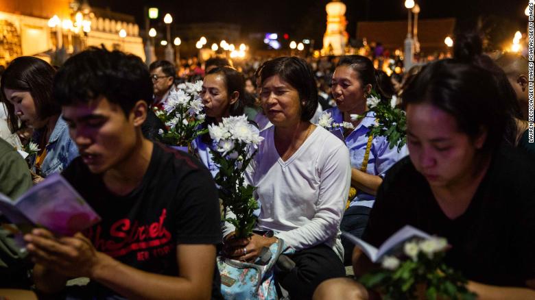 Mourners attend a vigil for victims of the mall shooting on Sunday in Korat, Thailand. 