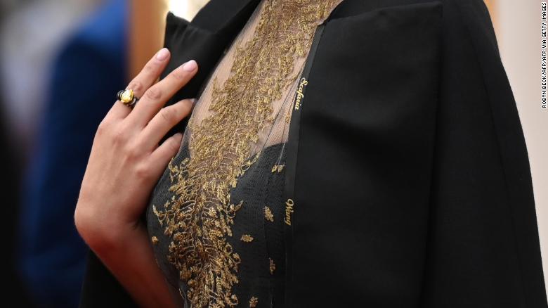 A close up shot of Natalie Portman&#39;s cape, embroidered with the names of female film directors who were not nominated for Oscars. (Photo by Robyn Beck / AFP) (Photo by ROBYN BECK/AFP via Getty Images)