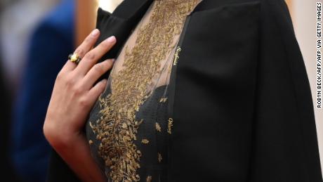 A close up shot of Natalie Portman&#39;s cape, embroidered with the names of female film directors who were not nominated for Oscars. (Photo by Robyn Beck / AFP) (Photo by ROBYN BECK/AFP via Getty Images)