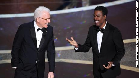 HOLLYWOOD, CALIFORNIA - FEBRUARY 09: (L-R) Steve Martin and Chris Rock speak onstage during the 92nd Annual Academy Awards at Dolby Theatre on February 09, 2020 in Hollywood, California. (Photo by Kevin Winter/Getty Images)