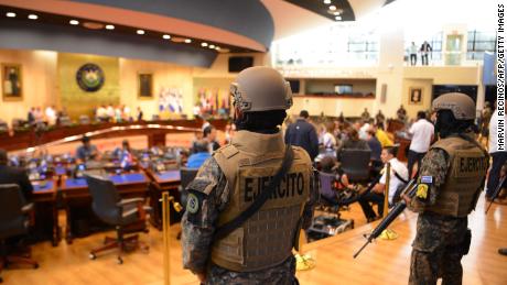 Members of the Salvadoran military inside the country&#39;s legislative assembly on Sunday. 