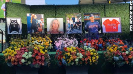 The makeshift shrine to John Altobelli, his wife, Keri, and their daughter Alyssa is adorned with poster-sized photos and flowers. 