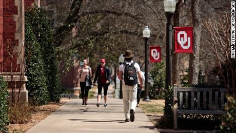 Students walk on campus between classes at the University of Oklahoma in Norman, Oklahoma.