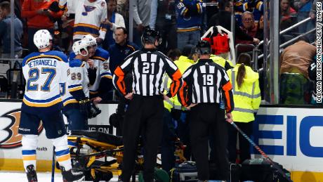 The St. Louis Blues watch as the paramedics tend to Jay Bouwmeester #19 of the St. Louis Blues after he collapsed on the bench during the first period of the game against the Anaheim Ducks at Honda Center on February 11, 2020 in Anaheim, California.
