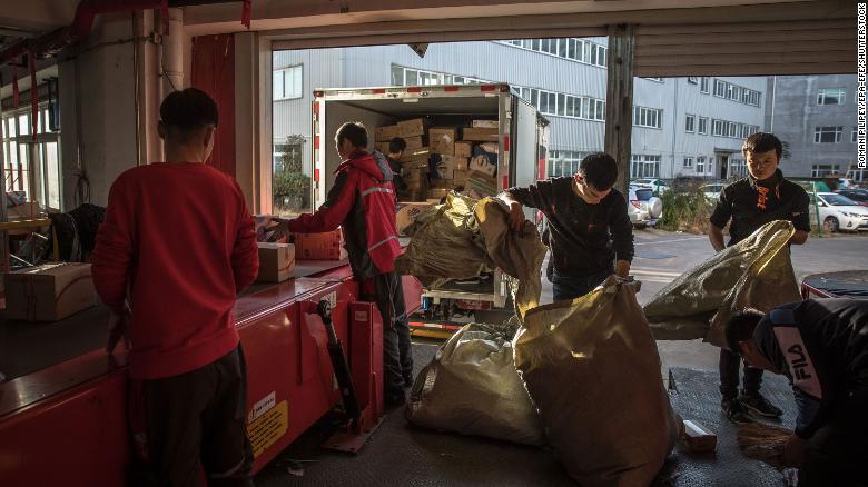 Workers sorting packages at a delivery station for JD.com in Beijing in November.