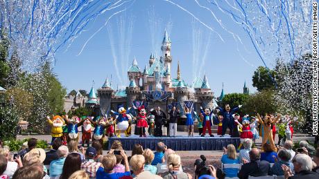 ANAHEIM, CA - JULY 17:  In this handout photo provided by Disney parks, Mickey Mouse and his friends celebrate the 60th anniversary of Disneyland park during a ceremony at Sleeping Beauty Castle featuring Academy Award-winning composer, Richard Sherman and Broadway actress and singer Ashley Brown July 17, 2015 in Anaheim, California.  Celebrating six decades of magic, the Disneyland Resort Diamond Celebration features three new nighttime spectaculars that immerse guests in the worlds of Disney stories like never before with &quot;Paint the Night,&quot; the first all-LED parade at the resort; &quot;Disneyland Forever,&quot; a reinvention of classic fireworks that adds projections to pyrotechnics to transform the park experience; and a moving new version of &quot;World of Color&quot; that celebrates Walt Disneys dream for Disneyland.  (Photo by Paul Hiffmeyer/Disneyland Resort via Getty Images)