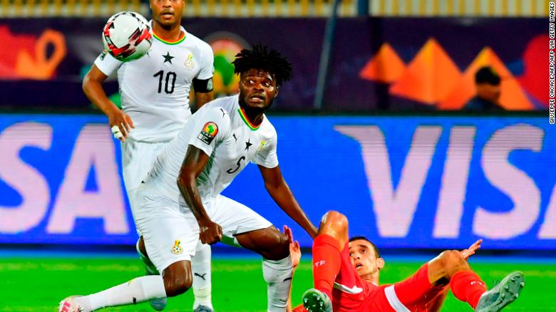 Partey (C) vies for the ball with Tunisia's forward Taha Yassine Khenissi (R) during the 2019 Africa Cup of Nations (CAN) Round of 16 football match between Ghana and Tunisia at the Ismailia Stadium in the Egyptian city on July 8, 2019.