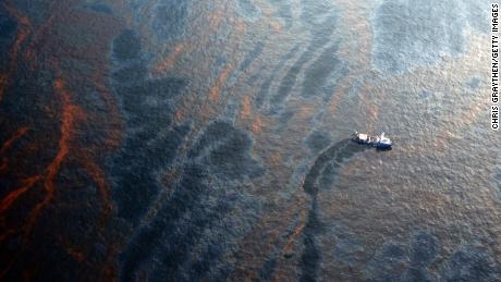 A boat works to collect oil that leaked from the Deepwater Horizon wellhead in the Gulf of Mexico near New Orleans on April 28, 2010, eight days after the explosion.