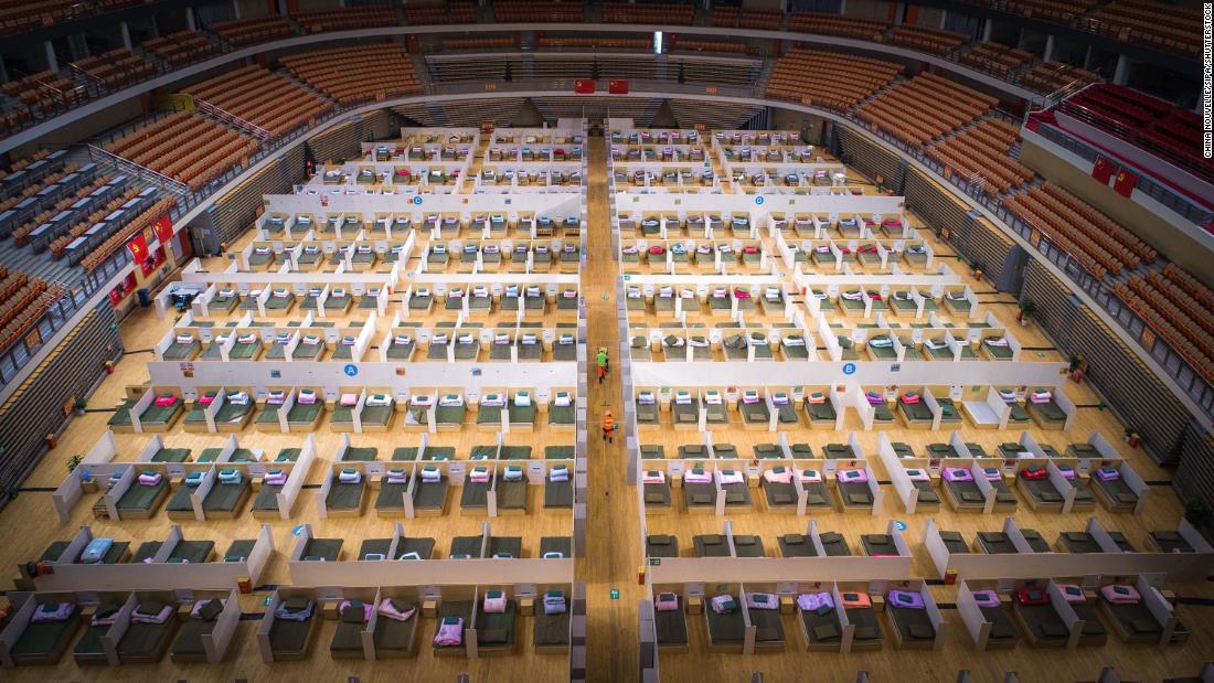 Beds are made in the Wuhan Sports Center, which was converted into a temporary hospital.