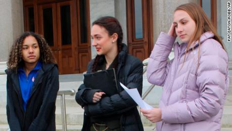 High school track athletes Alanna Smith, left, Selina Soule, center and and Chelsea Mitchell prepare to speak at a news conference outside the Connecticut State Capitol in Hartford, Connecticut, on February 12.