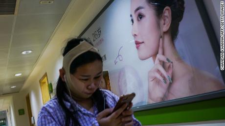 A woman pictured inside Huamei Medical Cosmetology Hospital in Shanghai.