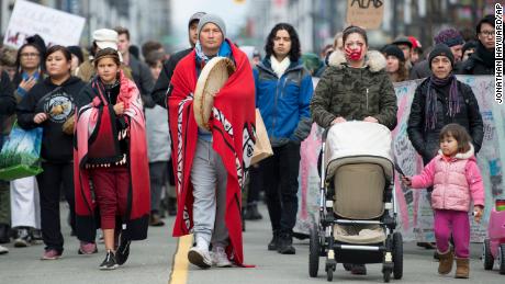 People demonstrating in solidarity with the Wet&#39;suwet&#39;en Nation walk in downtown Vancouver, British Columbia, on Wednesday,