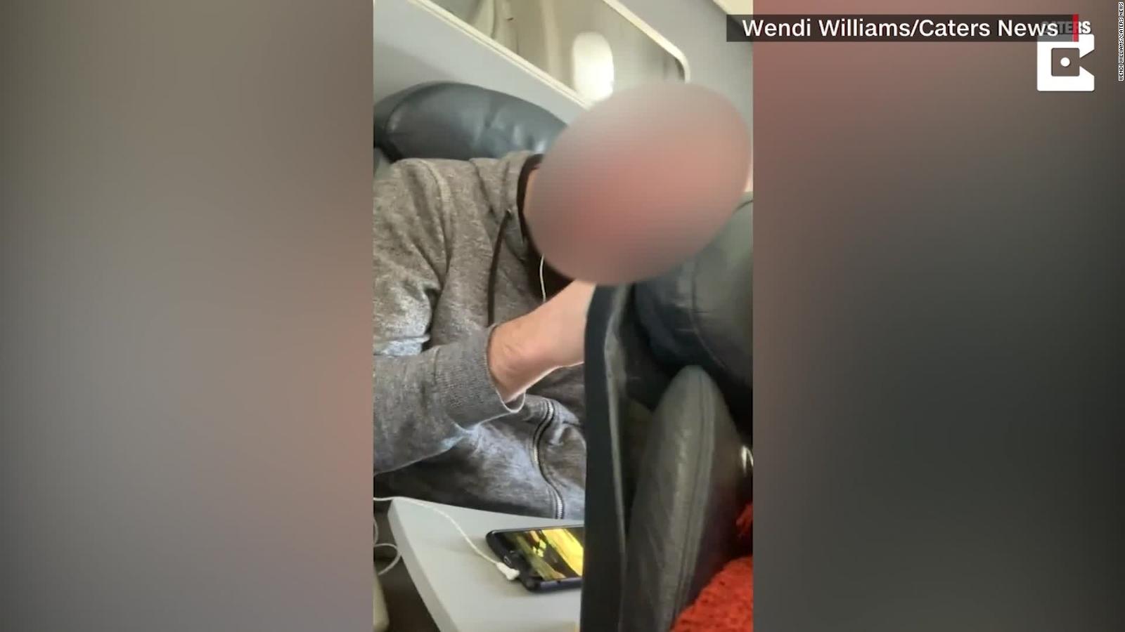 A Plane Passenger Filmed A Man Repeatedly Pushing Her Reclined