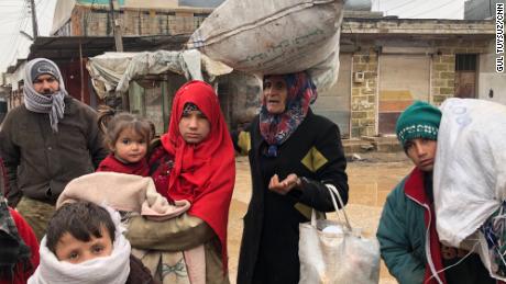 This family has been walking in freezing cold conditions for 7 hours. They fled their home in the middle of the night, packing some clothes into old flour bags