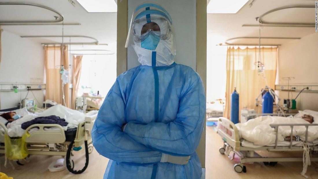 A medical worker rests at the isolation ward of the Red Cross hospital in Wuhan on February 16, 2020.