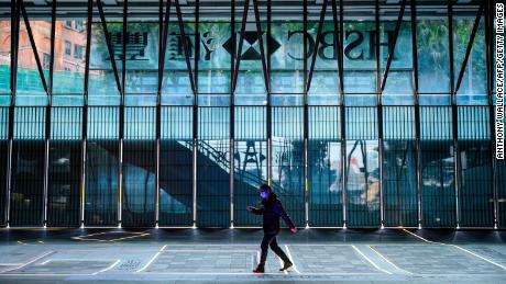 A man wearing a face mask walking past the shuttered HSBC building in Hong Kong in January. HSBC is dealing with with a growing list of negative headwinds, including protests in Hong Kong and the coronavirus outbreak.