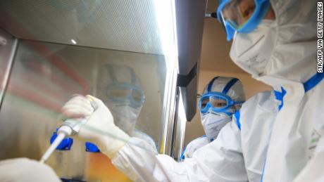 TOPSHOT - This photo taken on February 19, 2020 shows laboratory technicians testing samples of virus at a laboratory in Hengyang in China&#39;s central Henan province. - The death toll from the COVID-19 coronavirus epidemic jumped to 2,112 in China on February 20 after 108 more people died in Hubei province, the hard-hit epicentre of the outbreak. (Photo by STR / AFP) / China OUT (Photo by STR/AFP via Getty Images)