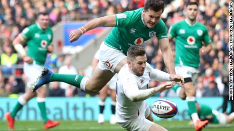 Elliot Daly beats Jacob Stockdale of Ireland to the ball to score England&#39;s second try his team&#39;s second try in the first half at Twickenham. 