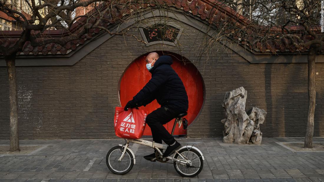 A man rides his bike in Beijing on February 23, 2020.