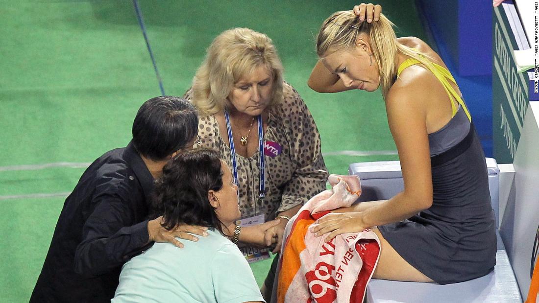 Despite her success, Sharapova also struggled with injuries in the early part of her career, suffering a series of shoulder issues that eventually required surgery in 2008. Here, she receives treatment while facing Petra Kvitova at the Torya Pan Pacific Open in Tokyo in 2011.  