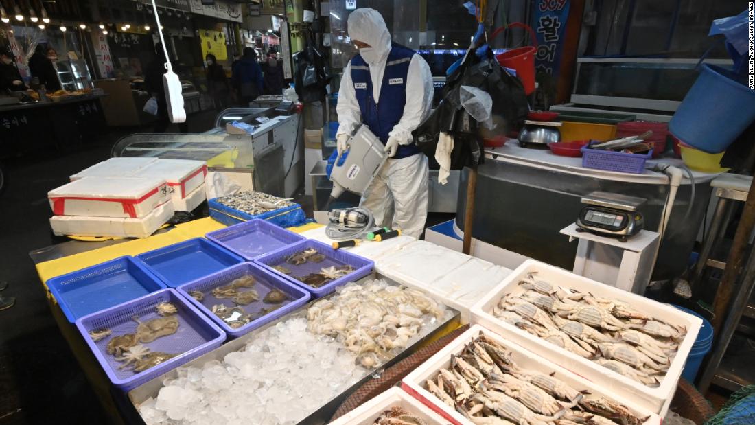 A worker disinfecting a market in Seoul, South Korea, on February 24. South Korea is now the largest outbreak outside China.