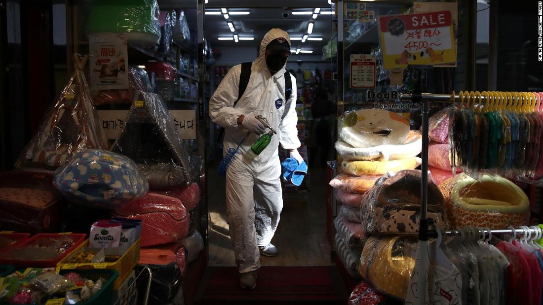 A traditional market in Seoul is disinfected on February 26. The South Korean government raised its coronavirus alert to the highest level, with confirmed case numbers continuing to rise. 