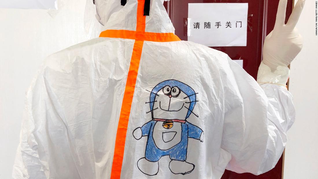 A medical staff member in the Wuhan Children&#39;s Hospital in Wuhan, China -- the epicenter of the coronavirus outbreak. At the isolation ward of infected children, many young patients were afraid of seeing the medical staff wrapped in protective suits. A nurse in the hospital came up with the idea of drawing cartoons on the protective suits and inviting children to color them, to make them feel more at ease.