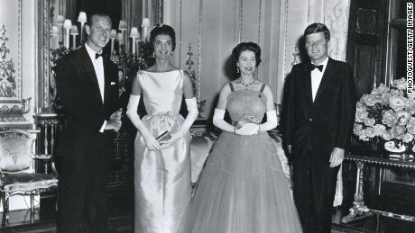 At Buckingham Palace during a banquest held in his honor, American President John F. Kennedy (right) and his wife, First Lady Jacqueline Kennedy (second left), pose with Queen Elizabeth II of Great Britain (second right) and her husband, Prince Philip, Duke of Edinburgh, London, United Kingdom, June 15, 1961.