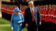 Queen Elizabeth II  and  Donald Trump inspect the guard of honour formed of the Coldstream Guards during a welcome ceremony at Windsor Castle in Windsor on July 13, 2018 
