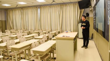 Teacher Zhang Weibao shoots a video course at a middle school in Urumqi, northwest China&#39;s Xinjiang Uygur Autonomous Region, on February 3, 2020. 