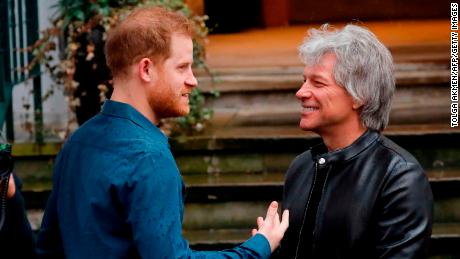 Prince Harry chats with singer Jon Bon Jovi at Abbey Road Studios in London on Friday, February 28.