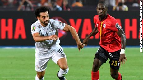 Azira vies for the ball with Egypt&#39;s forward Mohamed Salah (L).