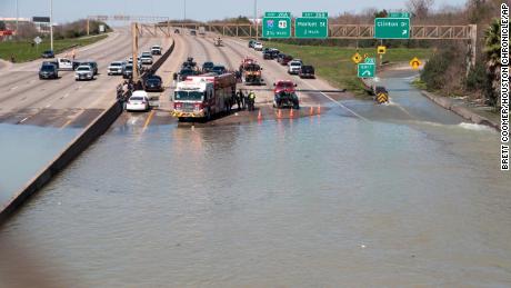 Water from a broken water main in east Houston flooded part of Interstate 610 on Thursday.
