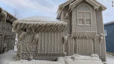 Homes along Lake Erie appear to be ice sculptures after gale-force winds covered them in spray that turned into giant icicles.