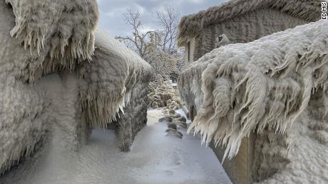 Ice completely coats the outside of the homes.