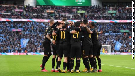 Manchester City players celebrate the first goal scored by Aguero.