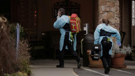 Medics prepare to transfer a patient on a stretcher to an ambulance at the Life Care Center of Kirkland, the long-term care facility linked to the two of three confirmed coronavirus cases in the state, in Kirkland, Washington, U.S. March 1, 2020. REUTERS/David Ryder