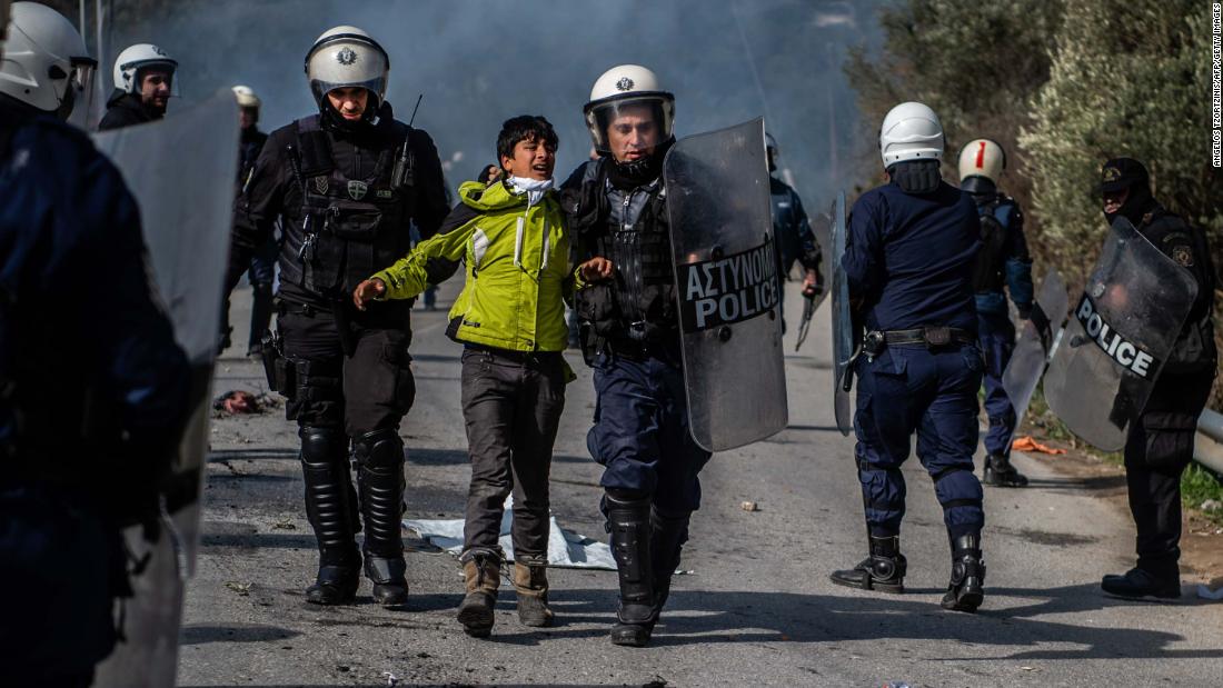 Police on the Greek island of Lesbos detain a youth during clashes near the Moria refugee camp on March 2.