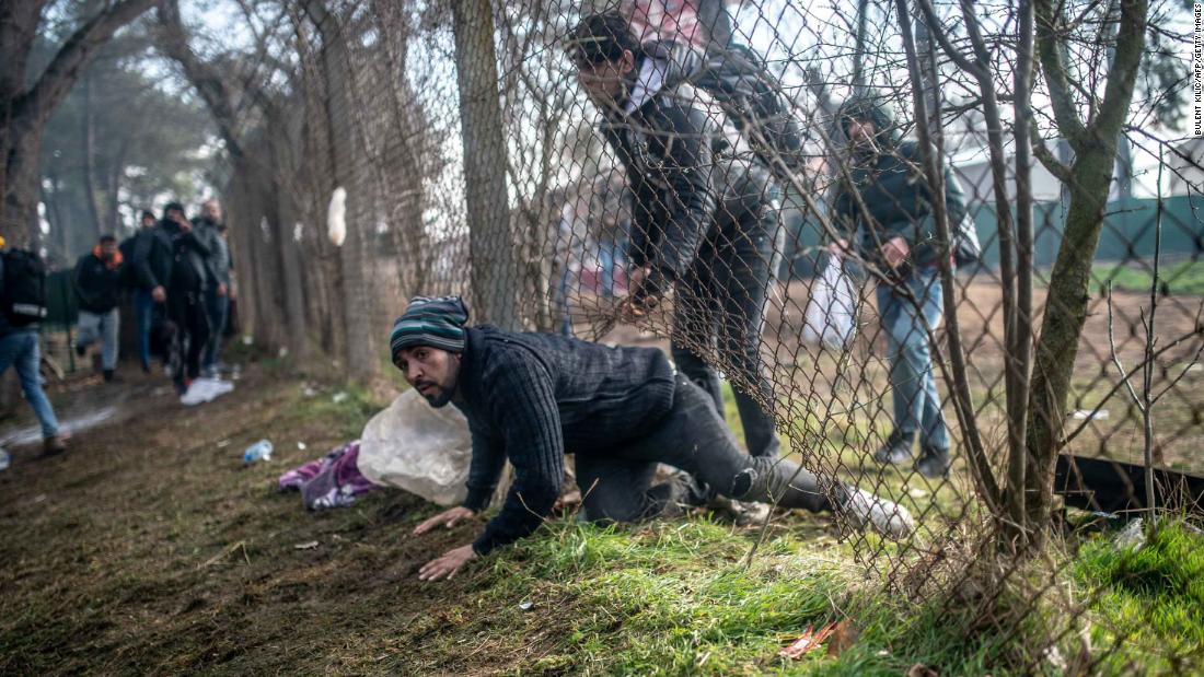 A migrant passes the buffer zone during clashes with Greek police at the Pazarkule crossing on February 29.