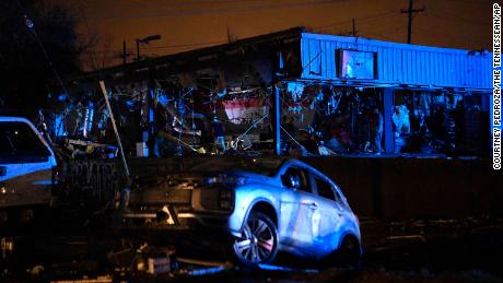 Damaged vehicles and buildings in East Nashville after a tornado hit the city in the early Tuesday.