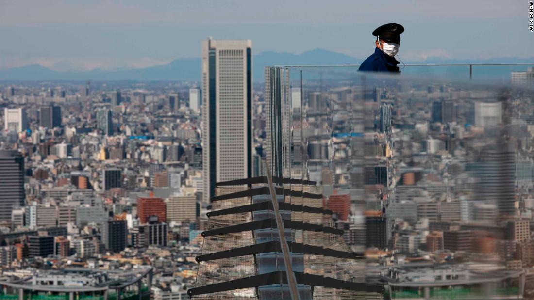 A security guard stands on the Shibuya Sky observation deck in Tokyo on March 3, 2020.