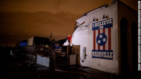 A mural reads &quot;I Believe in Nashville&quot; on the side of a heavily damaged music venue in Nashville, Tennessee.