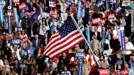PHILADELPHIA, PA - JULY 28:  Delegates stand and cheer on the fourth day of the Democratic National Convention at the Wells Fargo Center, July 28, 2016 in Philadelphia, Pennsylvania. Democratic presidential candidate Hillary Clinton received the number of votes needed to secure the party&#39;s nomination. An estimated 50,000 people are expected in Philadelphia, including hundreds of protesters and members of the media. The four-day Democratic National Convention kicked off July 25.  (Photo by Win McNamee/Getty Images)