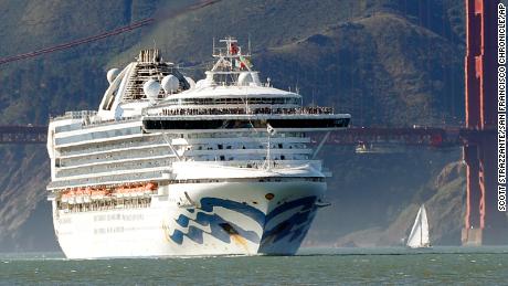 In this Feb. 11, 2020 photo, the Grand Princess cruise ship passes the Golden Gate Bridge as it arrives from Hawaii in San Francisco. California's first coronavirus fatality is an elderly patient who apparently contracted the illness on a cruise, authorities said Wednesday, March 4, and a medical screener at Los Angeles International Airport is one of six new confirmed cases. The cruise ship is at sea but is expected to skip its next port and return to San Francisco by Thursday, according to a statement from Dr. Grant Tarling, the chief medical officer for the Carnival Corp., which operates the Grand Princess. Any current passengers who were also on the February trip will be screened. (Scott Strazzante/San Francisco Chronicle via AP)