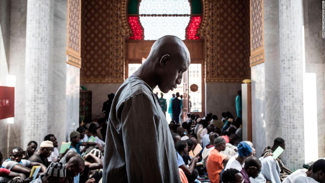 A Muslim worshipper attends a mass prayer against coronavirus in Dakar, Senegal.